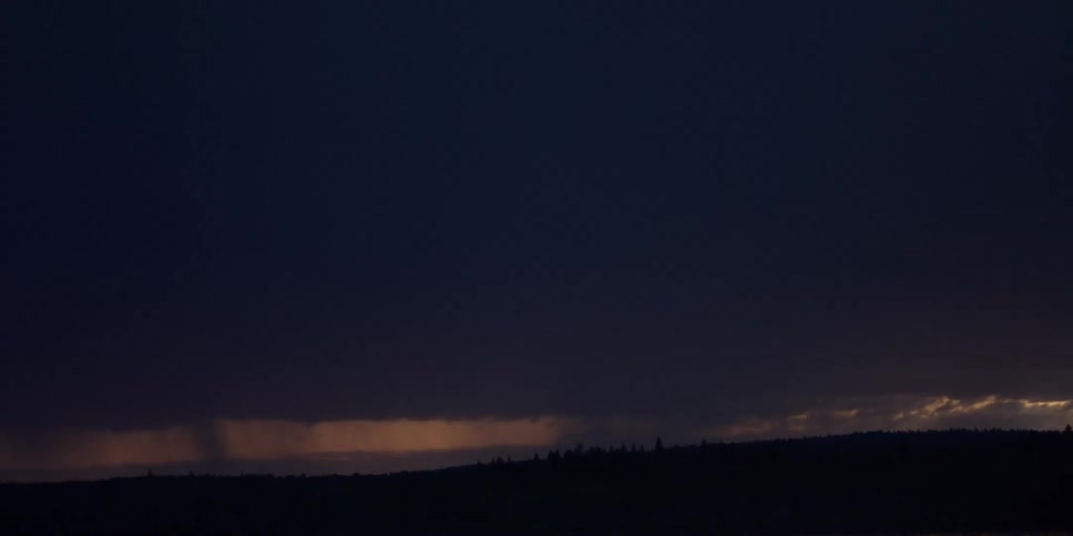 Silhouette of hills and trees at sunset