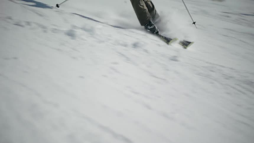 Skiers descend the slope