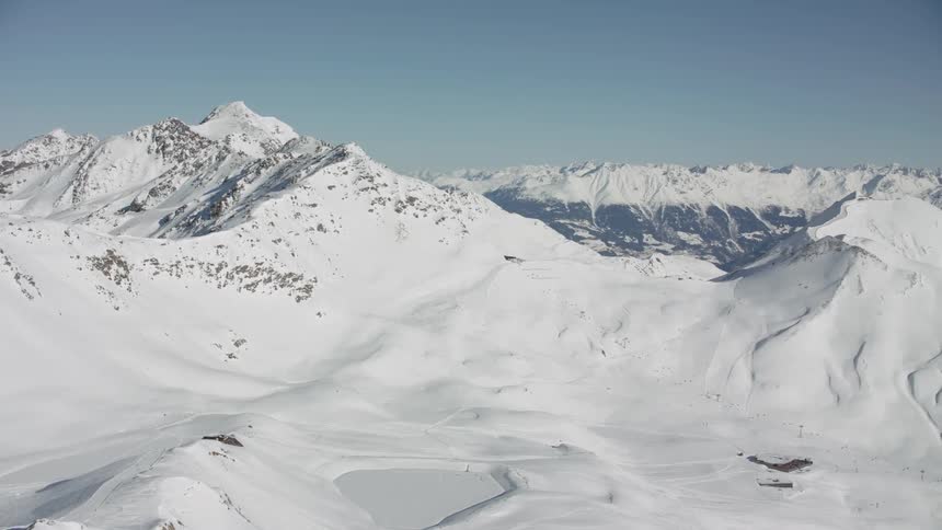 Sun shines down on snowy mountains
