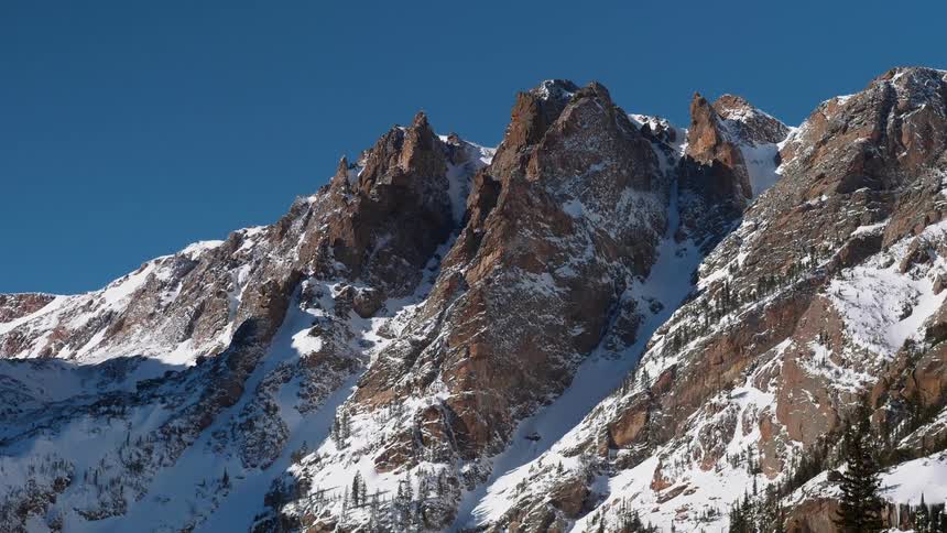 Jagged mountain ridges with snow