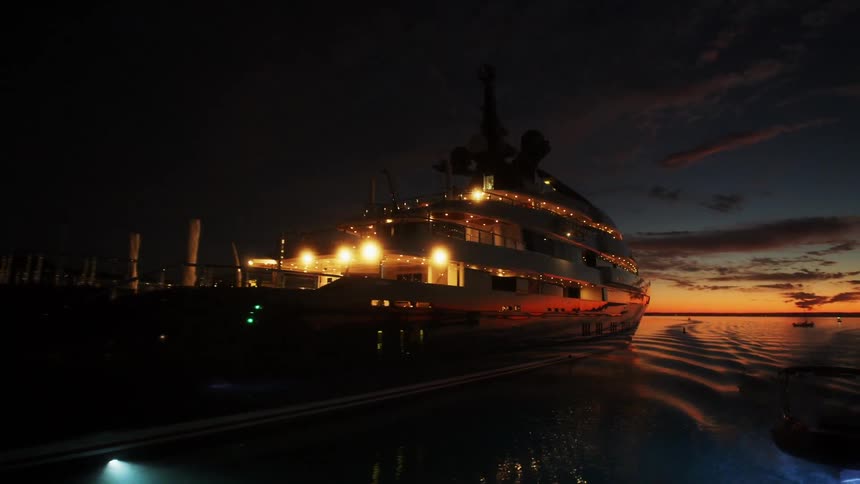 Cruise ship passing by at a dark sunset