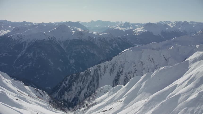 Sun shines down on snowy mountains