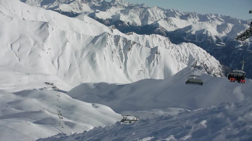 Ski lifts carry skiers up and down the slope