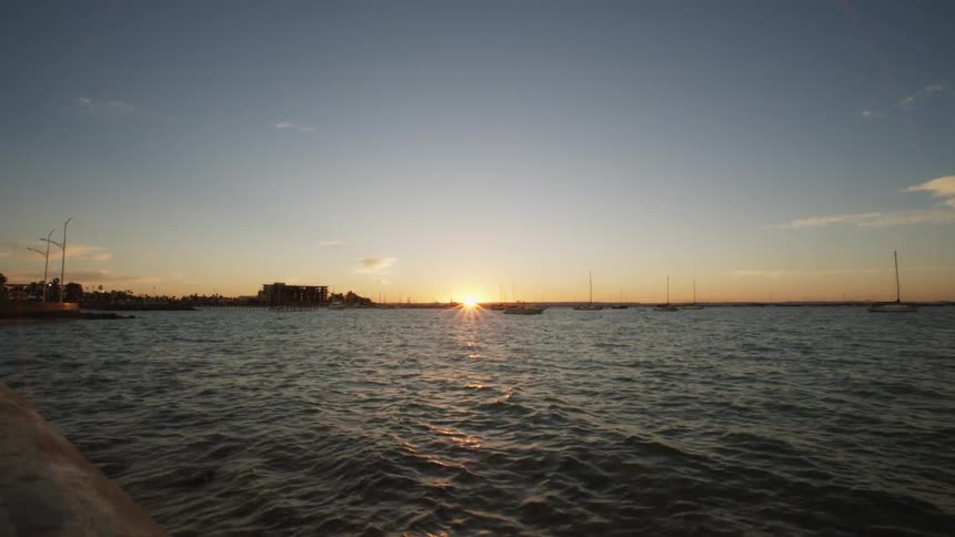 Water flows as the sun sets