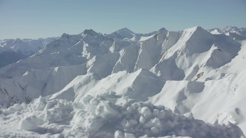 Icy and snow peaks in a mountainous area on a clear day