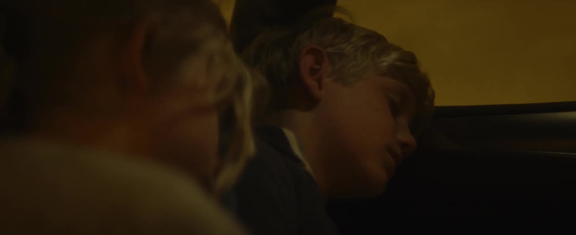 Kids are asleep in the backseat of a traveling car