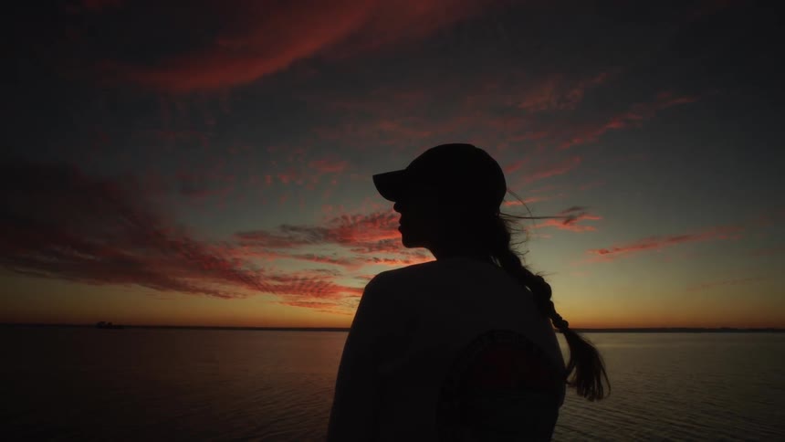 A woman rides on a boat