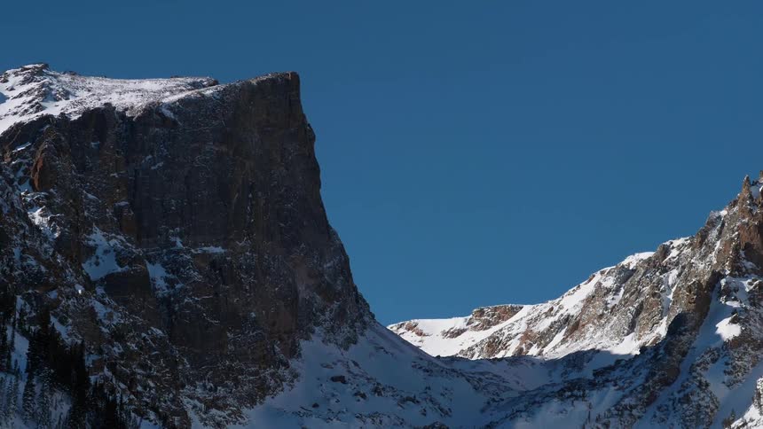 Snowy mountain peak on sunny day
