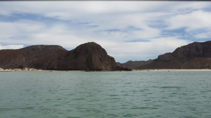 Large flowing body of water near hills