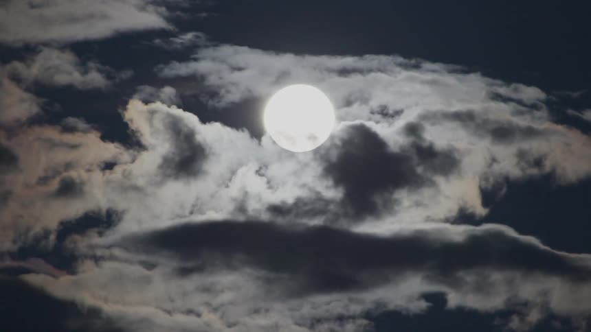 The moon is rising at night