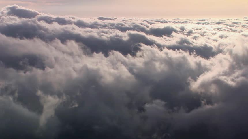 A bank of clouds roil across the sky