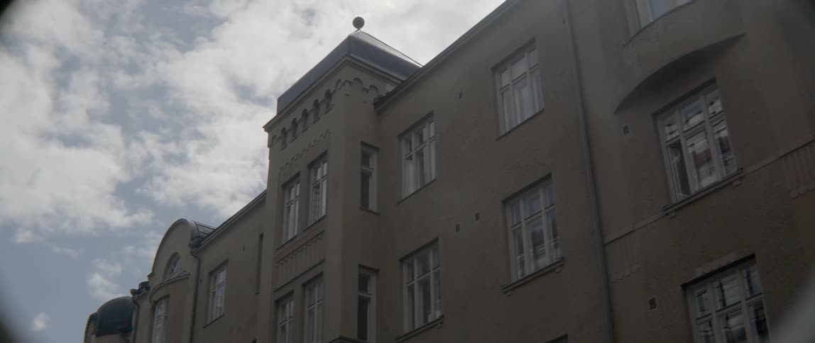 Traditional concrete masonry lines the exterior walls of a large metropolitan residential building.