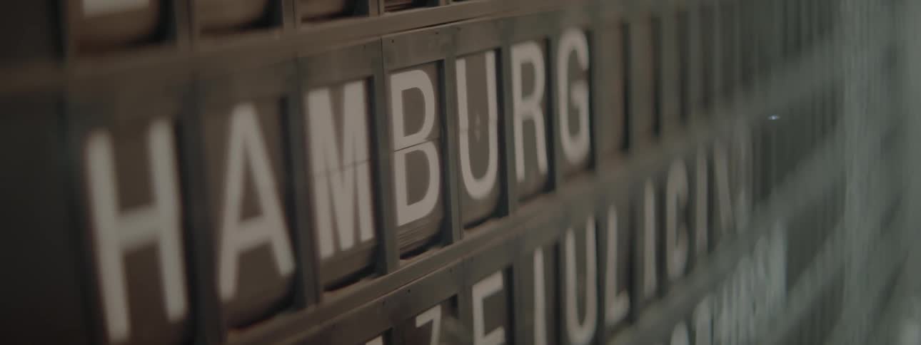 Letters and numbers flip into place on a travel board sign