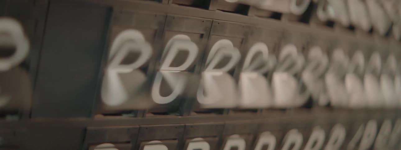 Letters and numbers flip on a split flap board