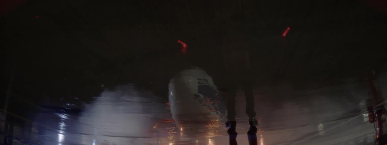 A man directs a taxiing airplane