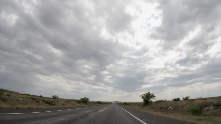 The road moves by fast near the fields