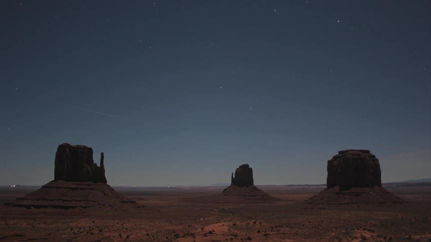 Time lapse of a desert with light clouds moving up high