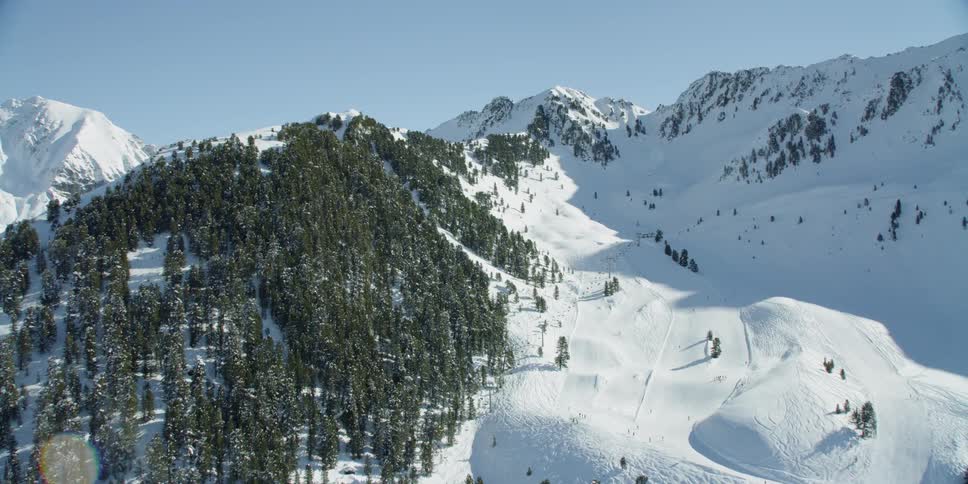 Snow covered mountain slopes on a sunny day