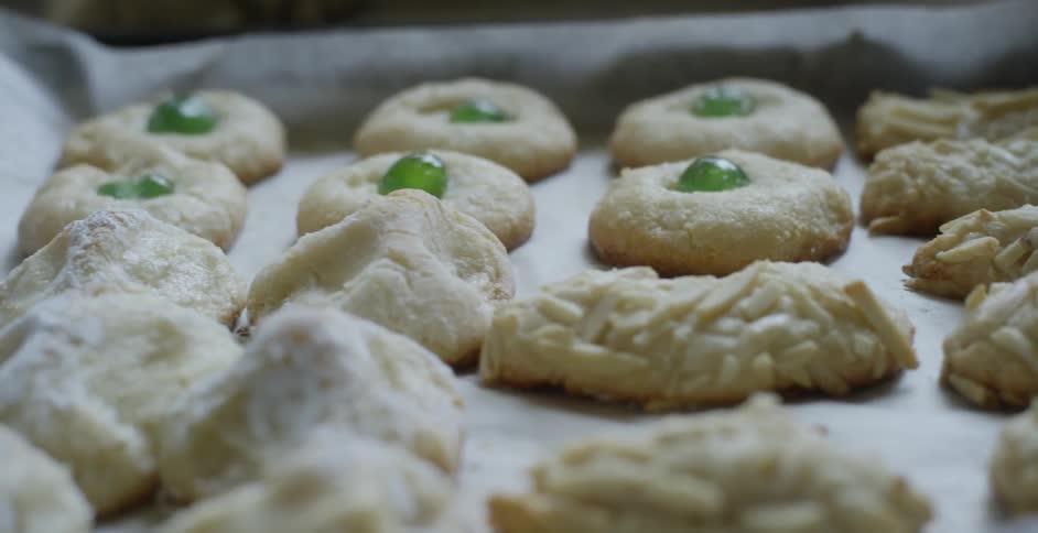 Baked goods lined up in a row on a cookie sheet