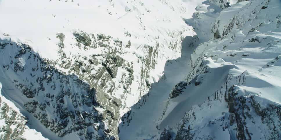Snow covered mountain canyon on sunny day