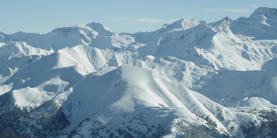 Sun shines down on snowy mountains
