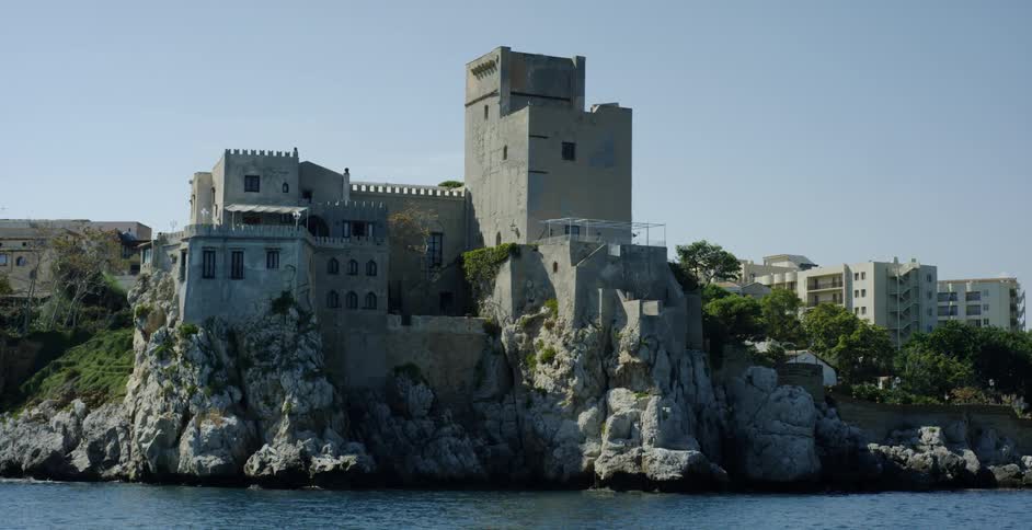 Old castle stands at the water's edge