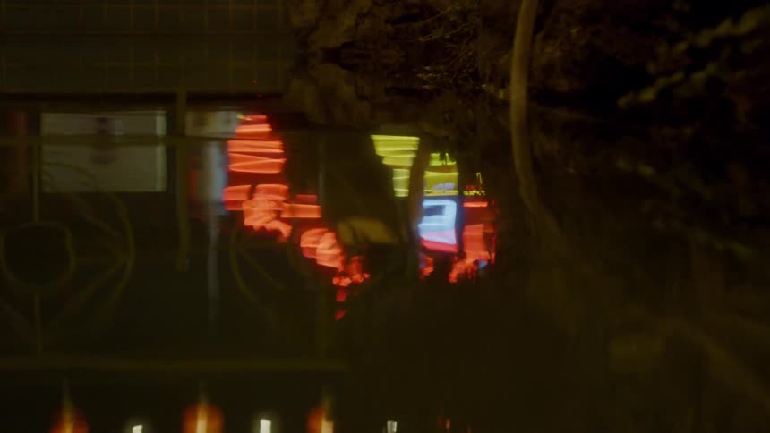 Lights reflect in rippling water