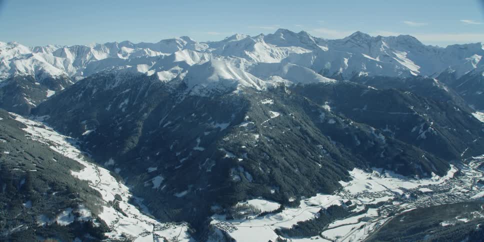 Sun shines down on snowy mountains