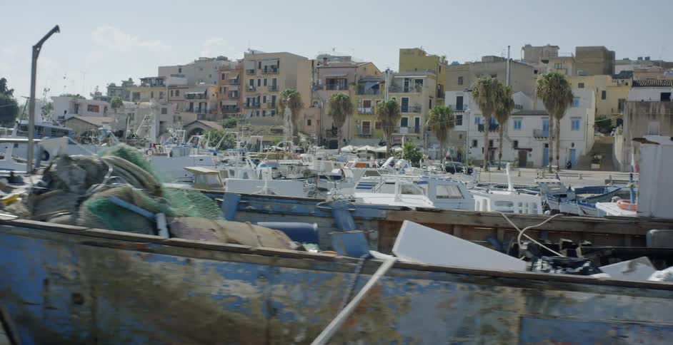 Fishing boats docked in a village marina