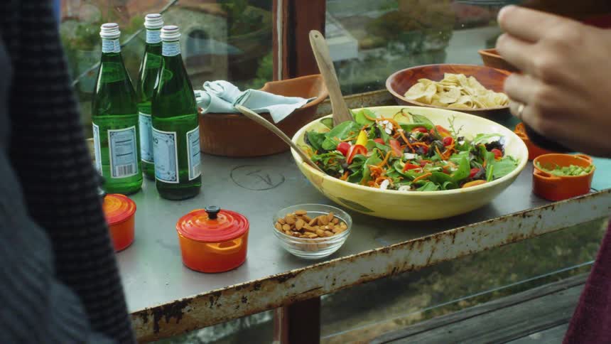 Bowls of food sit on a rusty table