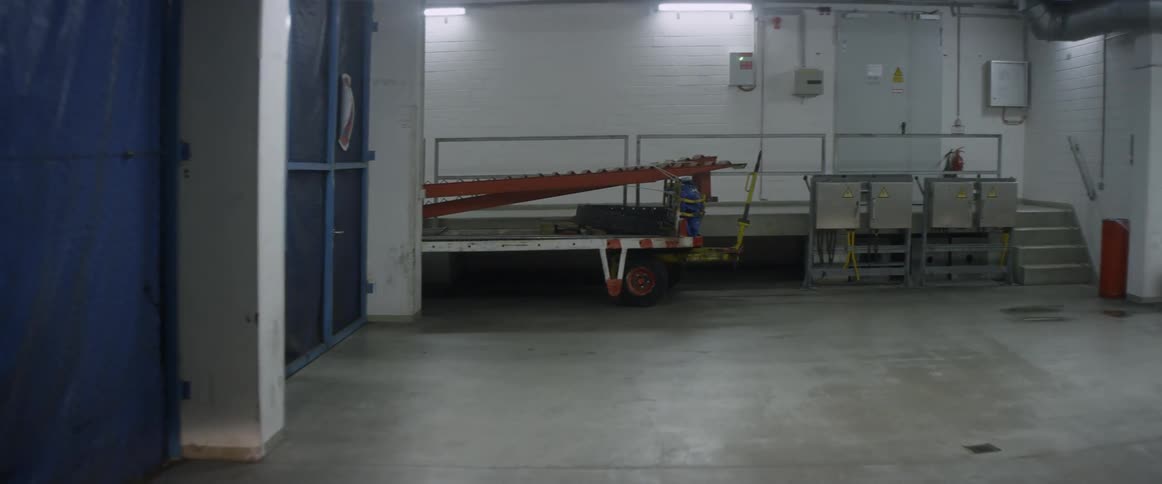 A vehicle is driving through an underground maintenance area