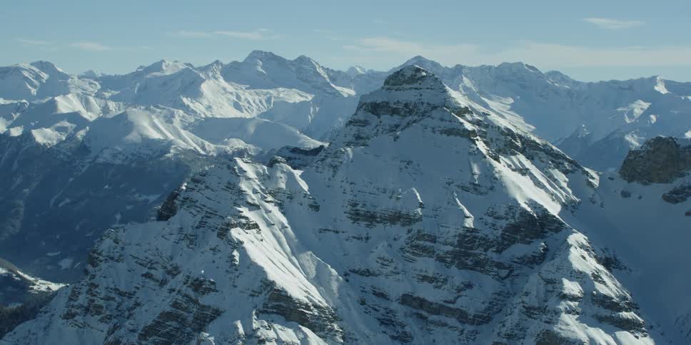 Mountains covered in snow on sunny day