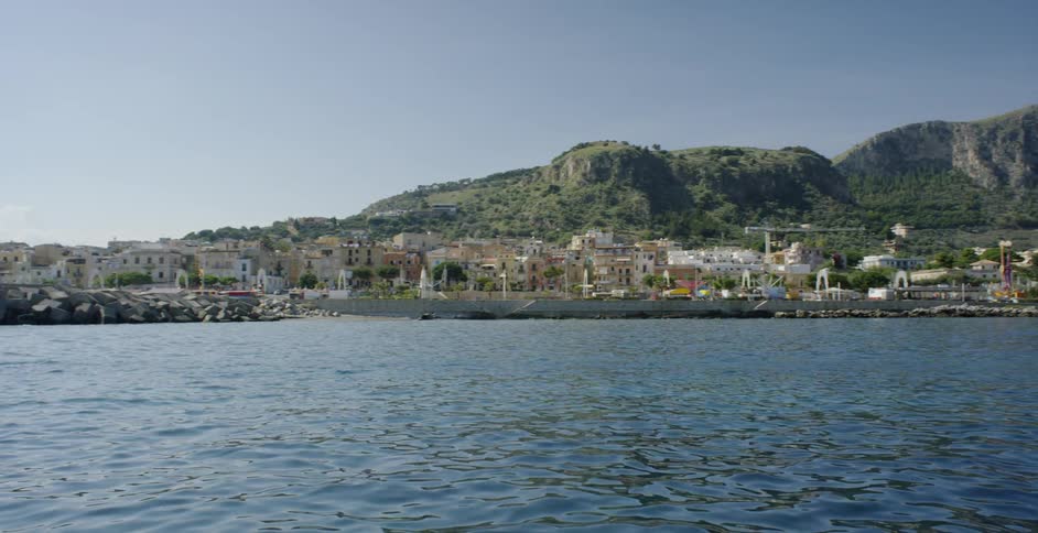 Large body of water with many buildings on shore