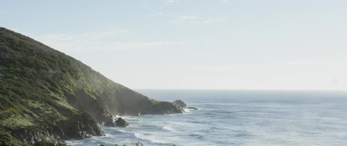 Waves crashing on a rocky cliff side