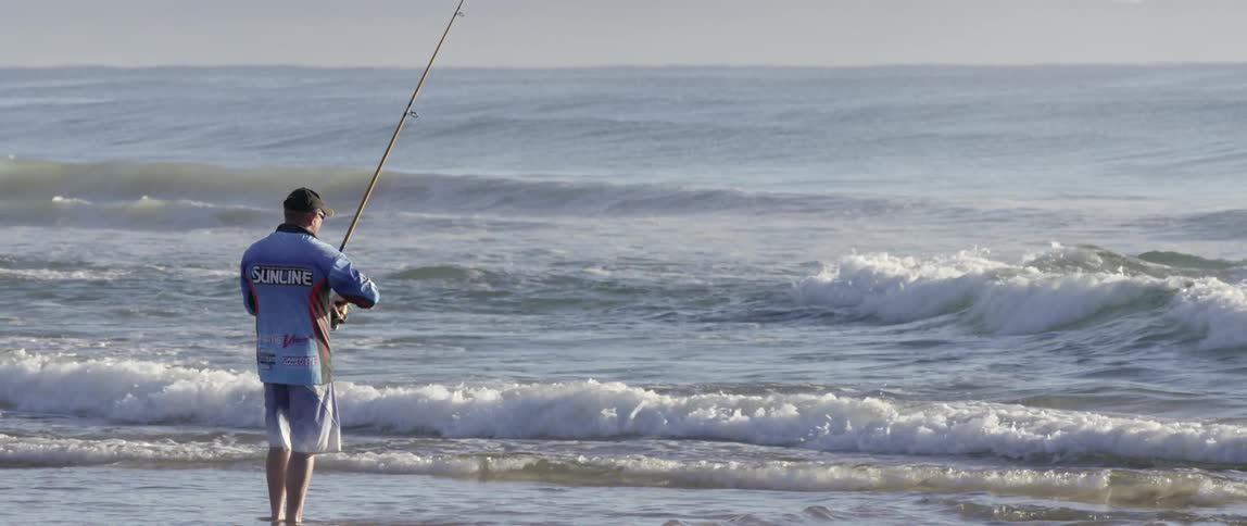 A person fishing in the ocean