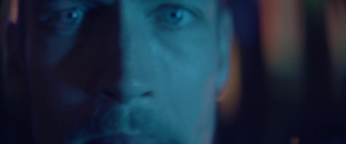The lower face of a mad male character talking aggressively during an argument.