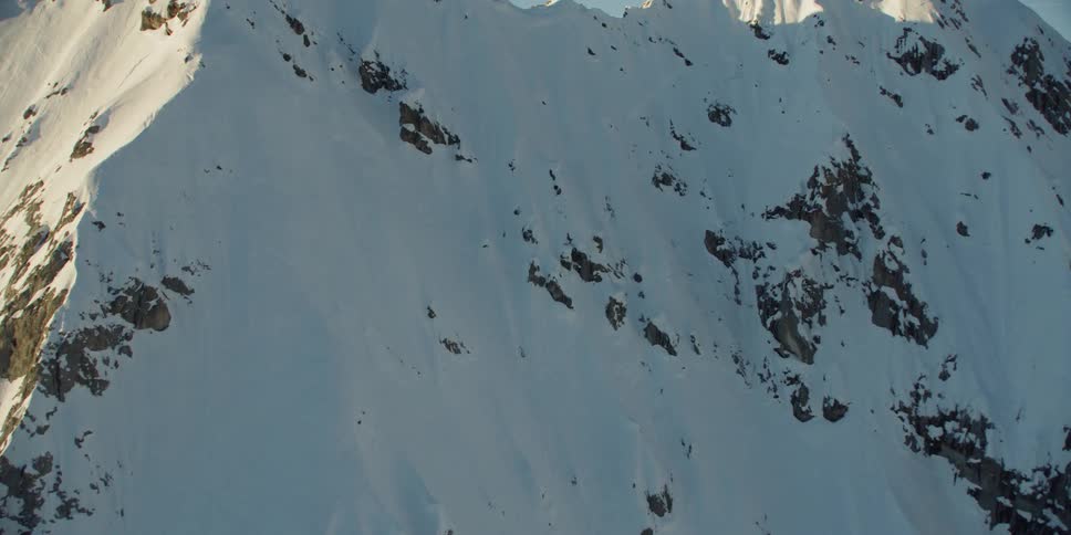 The tall mountains are covered with snow