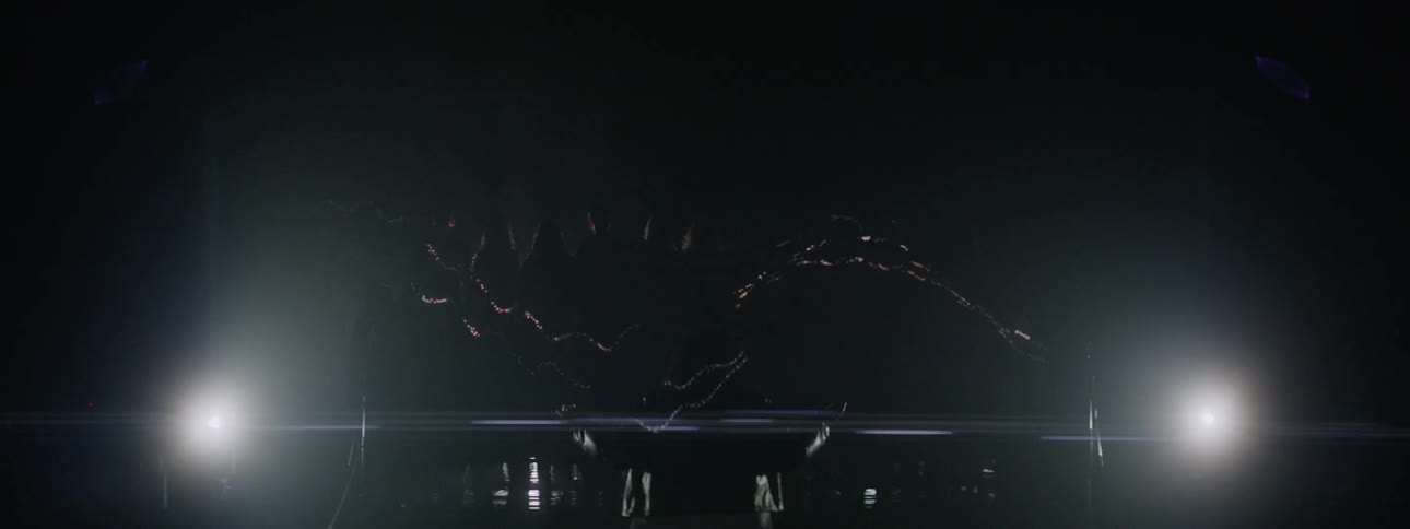 Lights strobe while a choir performs