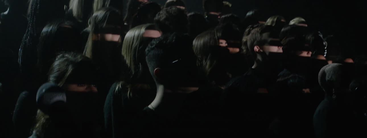 Lights strobe on a singing choir