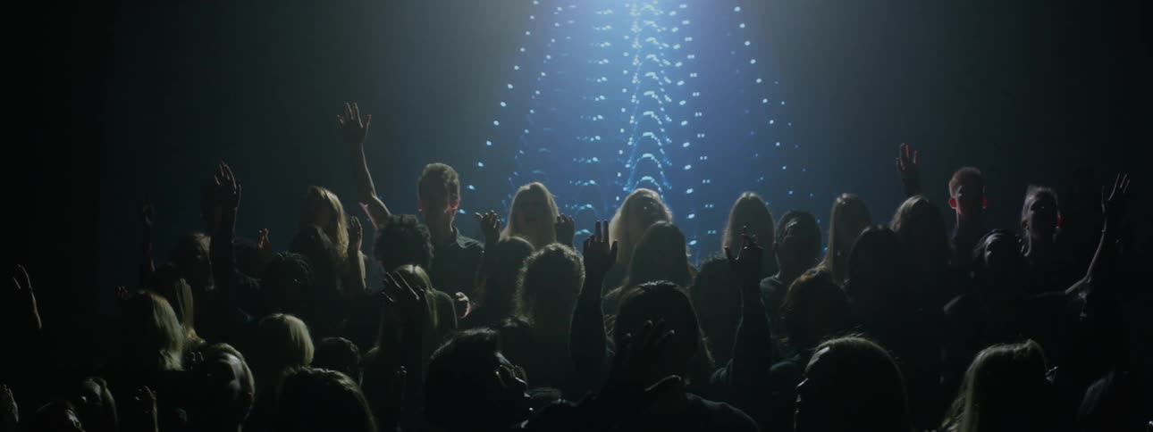 A choir performs on stage