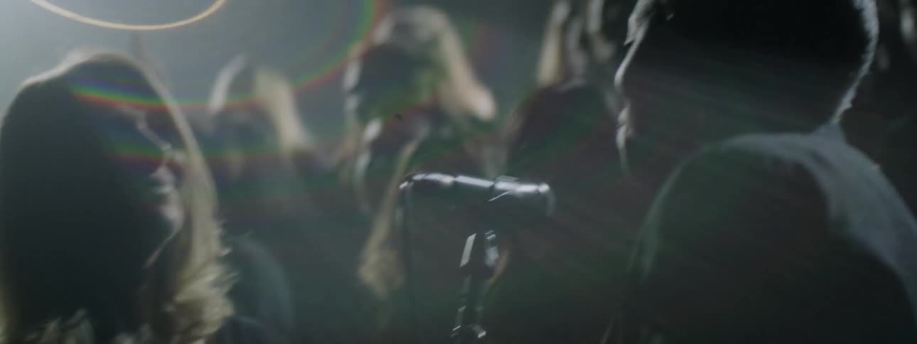 A group of people are on stage singing