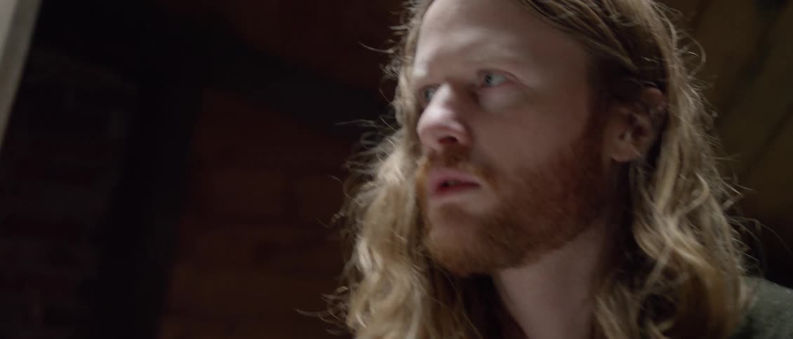 A man is nodding his head looking forward