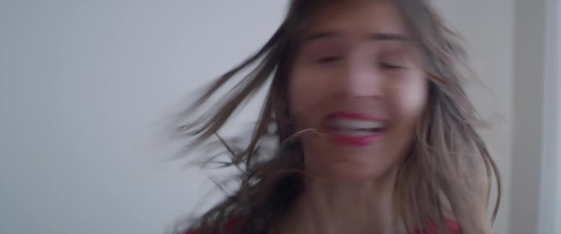 A woman dances happily