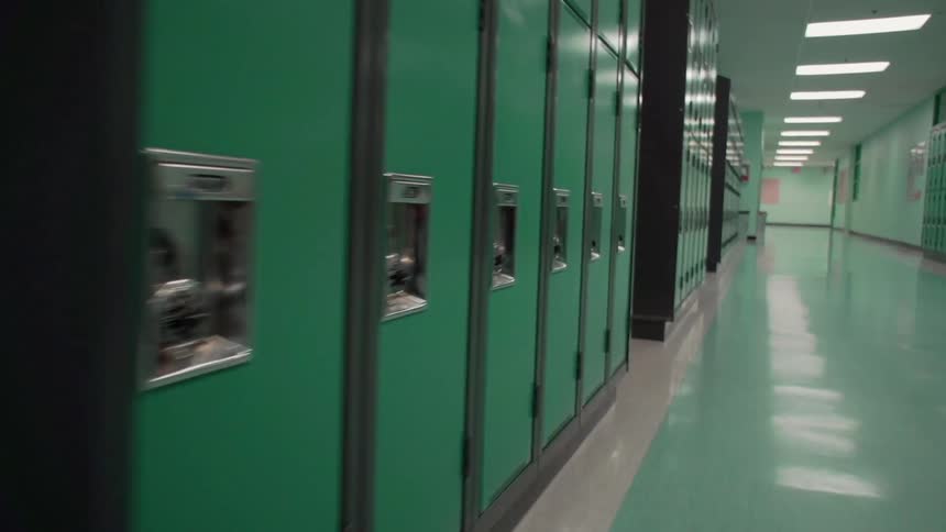 Green lockers line the school hallway