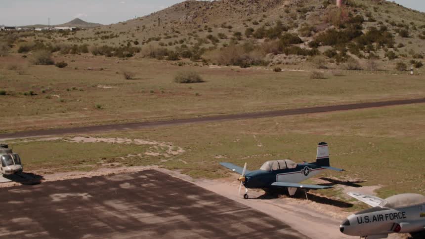 Aircrafts are parked all along the runway