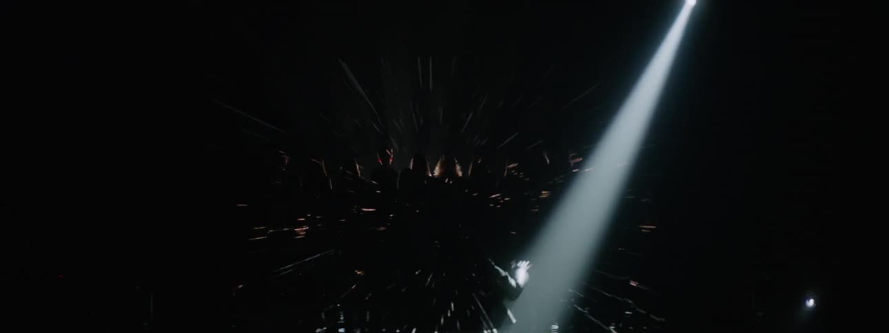 A projection plays behind a singing choir