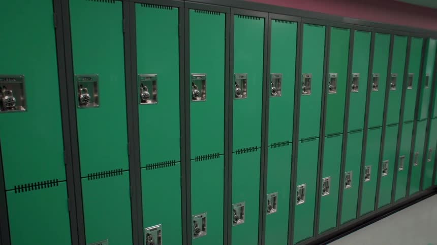 The row of lockers are green in color