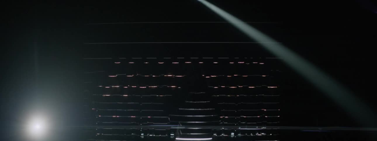 Lights strobe while a choir performs