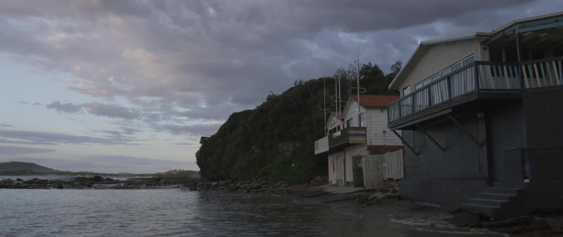 A city is shown at dusk