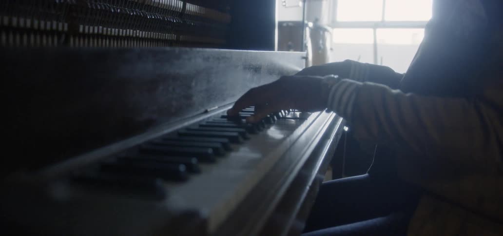Person plays the piano